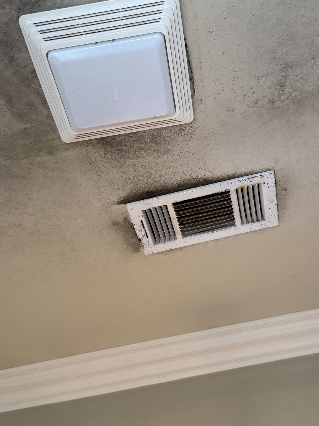 Clouding on a bathroom ceiling around the exhaust fan and supply vent